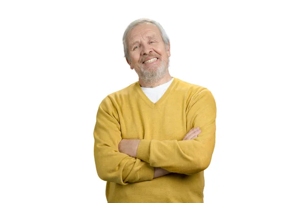 Old cheerful man with arms crossed. — Stock Photo, Image