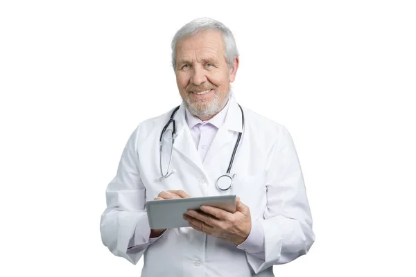 Portrait of happy senior doctor with tablet. — Stockfoto