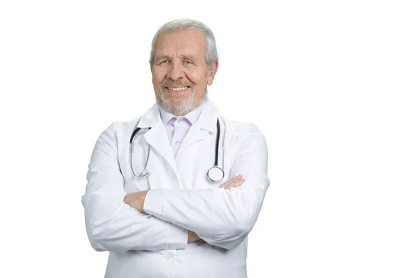 Old smiling doctor with arms crossed. — Stock Photo, Image