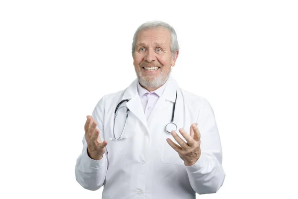 Happy kind old doctor gesturing with hands. — Stockfoto