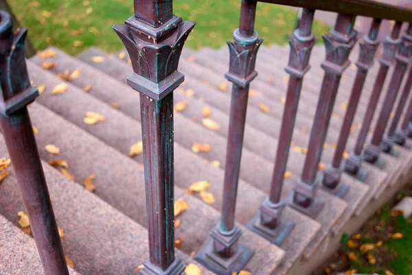 Downstairs with metal railings. — Stock Photo, Image