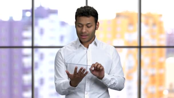 Young man giving business presentation with glass tablet mockup. — Stock Video