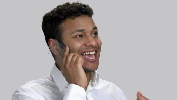 Close up portrait young hindu man having good news on phone. — Stock Video