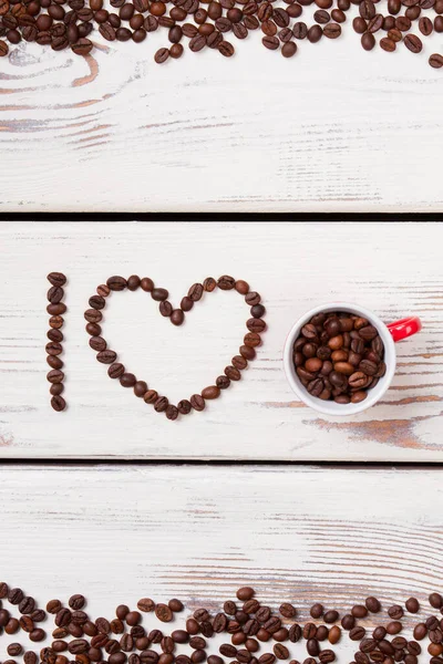 Creative concept of I love coffee sentence made of beans.