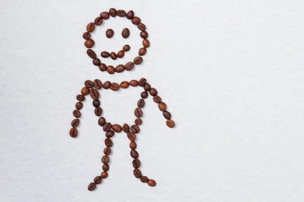 Cheerful boy made of coffee beans. — Stock Photo, Image