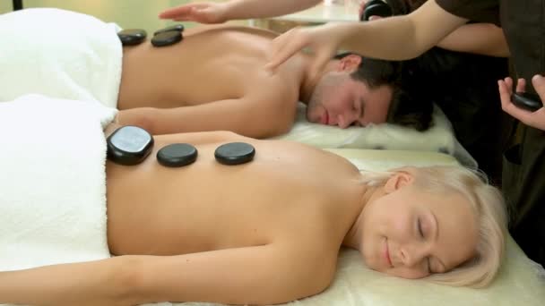 Stone therapy at spa salon. — Stock Video