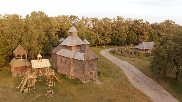 Aerial view of wooden church and bell in rural area. — Stock Photo, Image