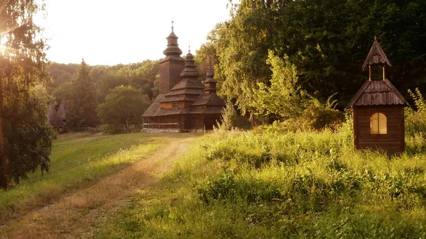 Wooden brown church and nearly overgrown path. — Stock Photo, Image