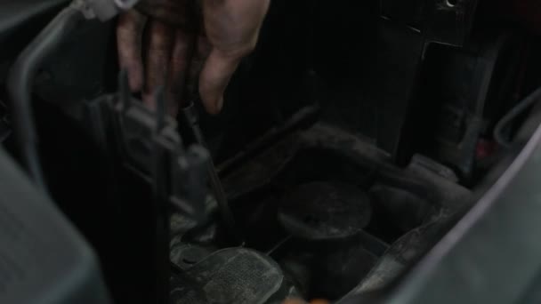 Close up man screwing car engine screws. — Stock Video