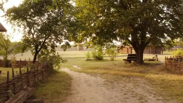 Rural wooden bench in the village. — Stock Video