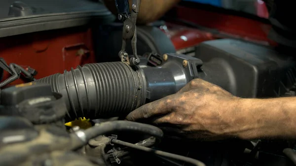 Close up worker installing car engine hose. — Stock Photo, Image