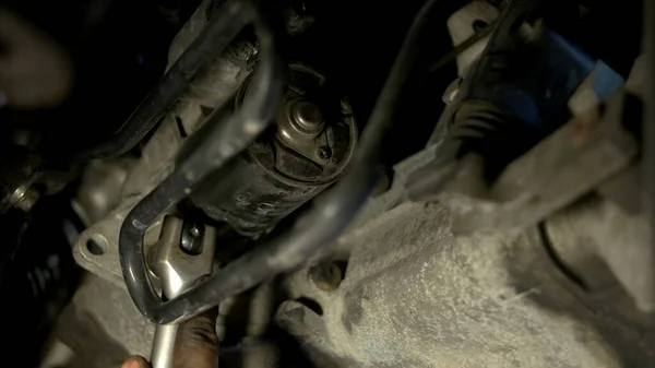 Installing crankcase protection by two auto mechanics. — Stock Photo, Image