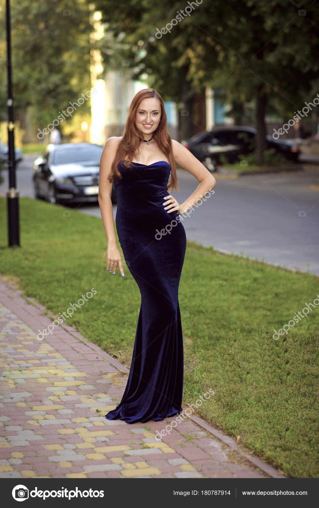 Fashion Red Hair Model Posing Sexy Wearing Long Blue Evening