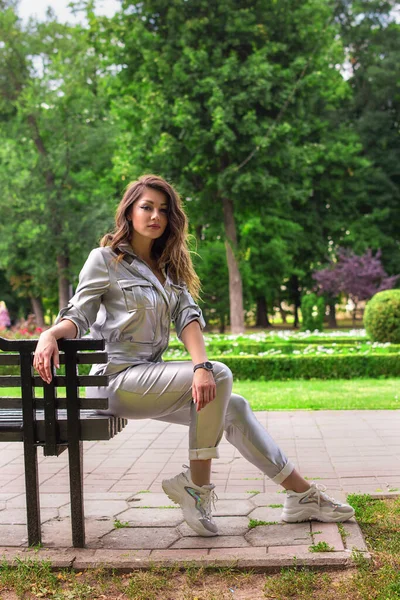 Seductive Woman Sitting Bench Beautiful Girl Silver Costume Park — Stock Photo, Image