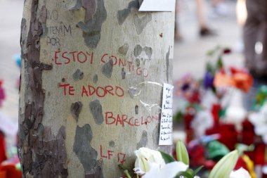 BARCELONA/SPAIN - 21 AUGUST 2017: People reunited on Barcelona`s Rambla, where 17th of August 2017 has been a terrorist attack, giving tribute to the at least 15 fatal victims and over 120 injured. clipart