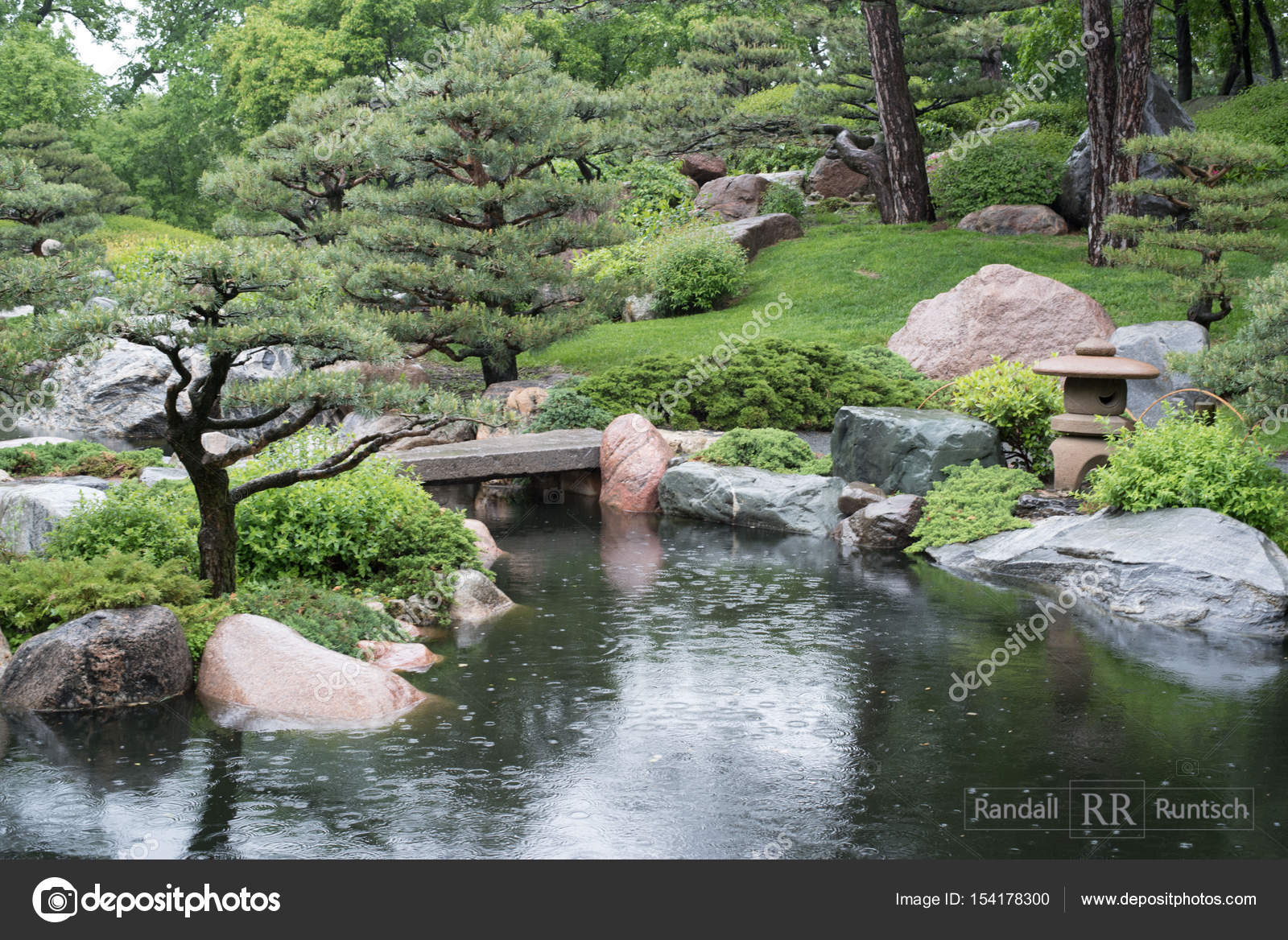 Stone Lanten And Bridge In Japanese Garden Stock Photo Rruntsch A Stone Lantern Near Bridge That Crosses Pond In Japanese Garden Photo By Rruntsch