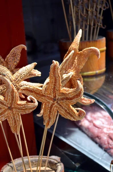 Fried starfish and fried Seahorse - China traditional food at Wangfujing street in China