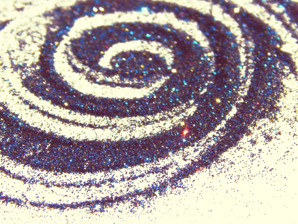 Spirale floue de paillettes bleues, rouges et dorées aux couleurs vintage — Photo