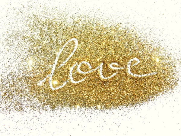 Word Love of golden glitter sparkles on white background