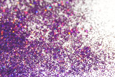 Bulanık arka plan üzerinde beyaz mor glitter pırıltı ile