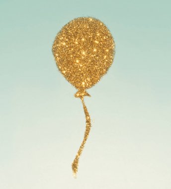 Hava balonu altın glitter, mavi arka plan üzerinde parıldıyor