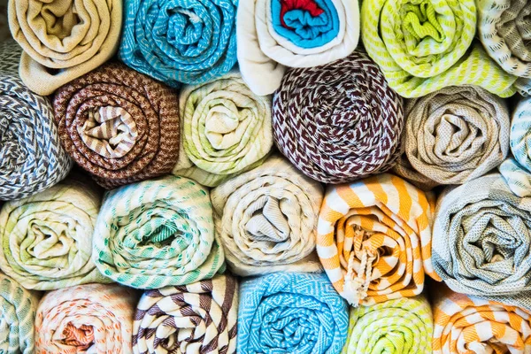 Bright, colorful Turkish fabrics, bedspreads and kerchiefs with different oriental patterns. The texture of the textile or fabric, macro. Tissue, textile, cloth, material, woven. — Stock Photo, Image