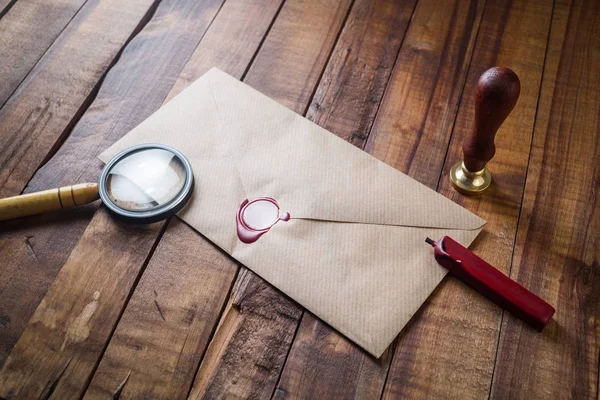 Envelope, magnifier and seal — Stock Photo, Image