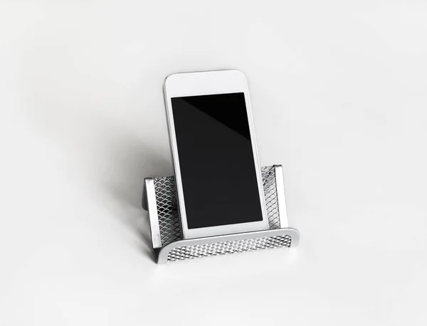 Cellphone on stand — Stock Photo, Image