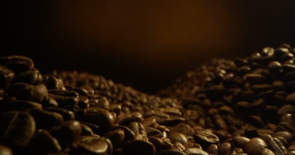 Piles Coffee Beans Laying Camera Hovering Yellow Black Background Macro — Stock Video