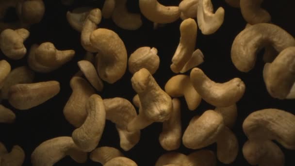 Cashew Nuts Flying Air Free Fall Slow Motion Black Background — ストック動画