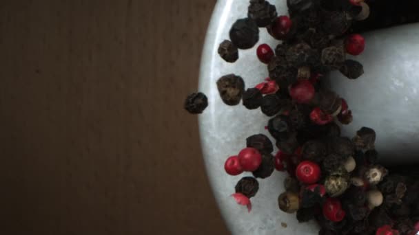 Mixed Pepper Seeds Crushed Marble Mortar Pestle Wooden Background Shot — Αρχείο Βίντεο