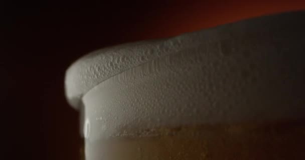 Macro Beer Froth Pouring Out Glass Terra Cotta Background Shot — 비디오