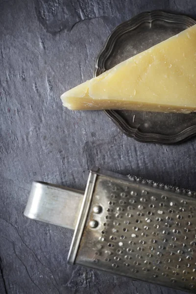 Cheese and grater on the stone background vertical — Stock Photo, Image