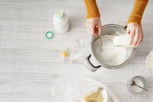 Woman makes the dough in the pan — Stock Photo, Image