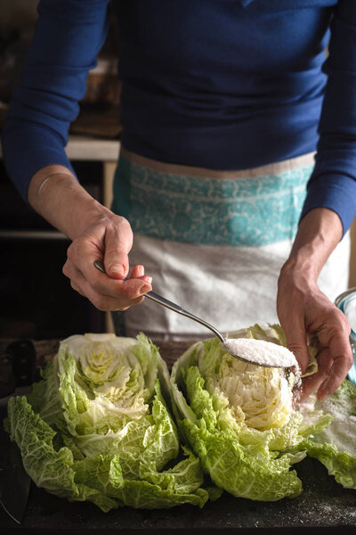 Woman cooking  kimchi vertical