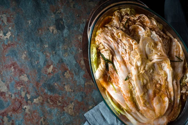 Kimchi on the old stone background top view — Stock Photo, Image