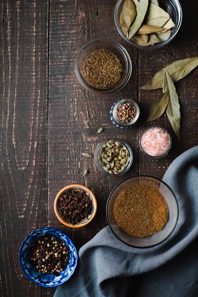Different spices on a wooden table — Stockfoto