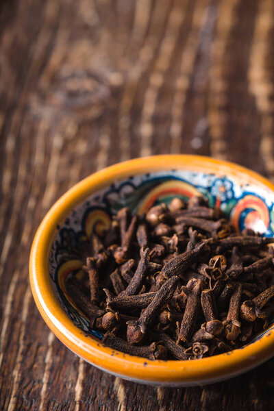 Seeds carnation in a yellow bowl on a table
