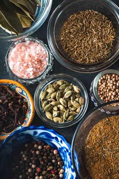 Various spices in a ceramic bowl on slate closeup — Stock Photo, Image