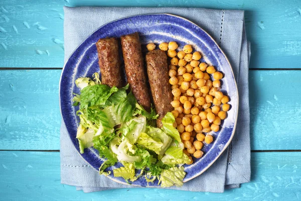 stock image Chevanchichi with lettuce and chick-pea on a plate