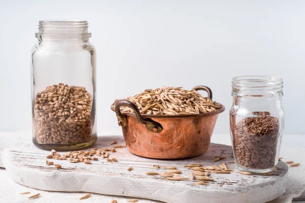 Different grain on the white table horizontal — Stock Photo, Image