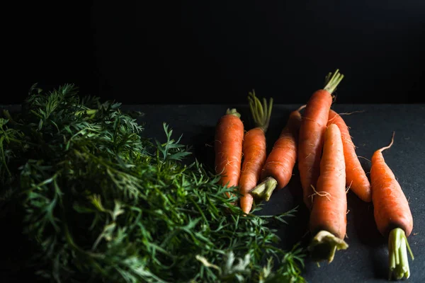 Cut from the carrot tops side view — Stock Photo, Image