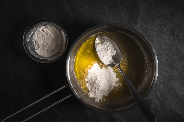Flour in melted butter for roux cooking — Stock Photo, Image