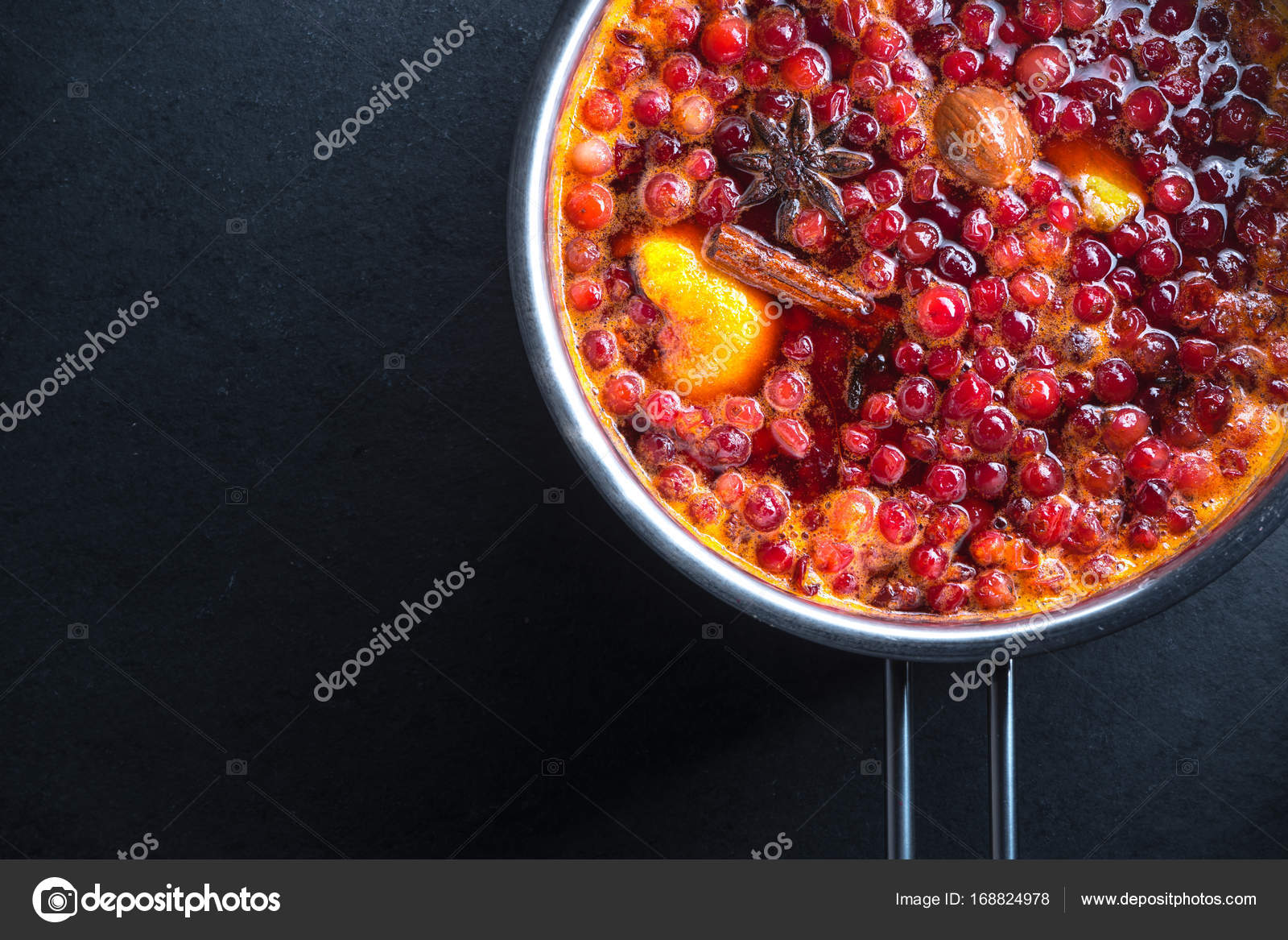 Preparation of sauce from cranberry, peel and nutmeg Stock Photo by