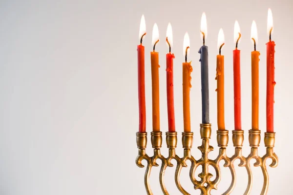 Brass hanukiya with lighted candles close-up — Stock Photo, Image