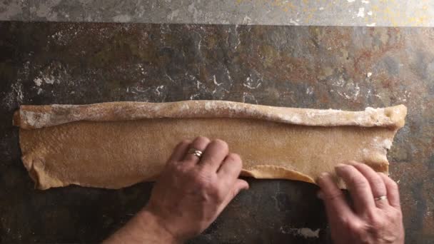 Man twists the dough for pasta. Video — Stock Video