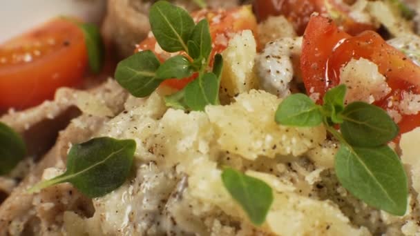 Cheese, basil leaves and cherry on pasta. Video — Stock Video