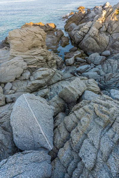 Ray of sun on grey stones and the sea in Greece — Stock Photo, Image