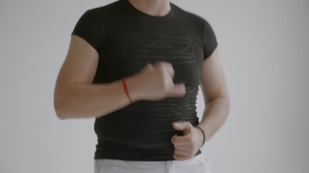 Young man rehearsing Caribbean dance fragment very close-up — Stock Video