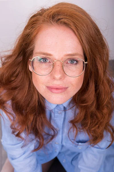Portrait of beautiful red-haired woman with glasses from above — Stock Photo, Image